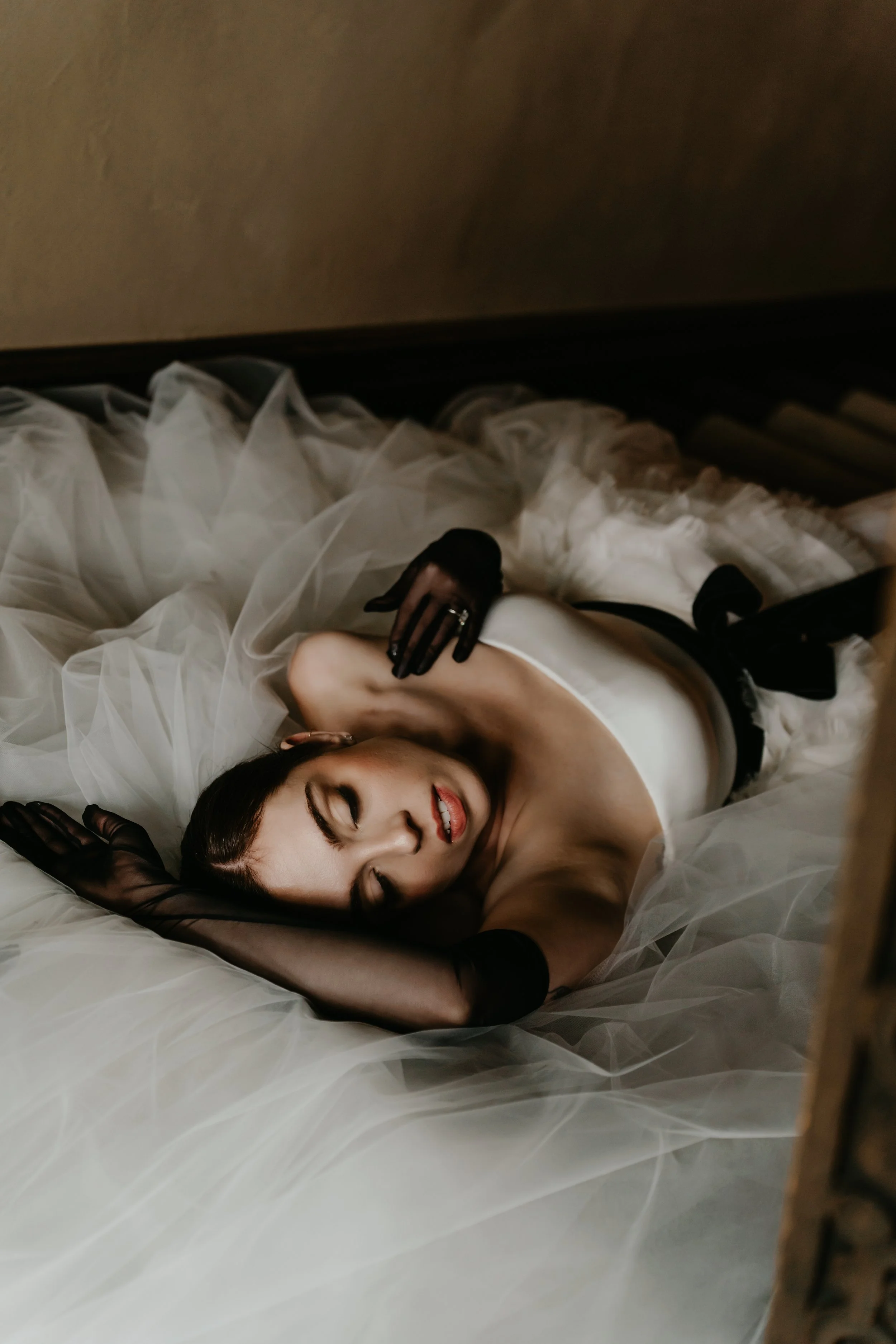 Editorial overhead bridal portrait surrounded by layers of a Vera Wang wedding gown, photographed by Julia Brown Photo.