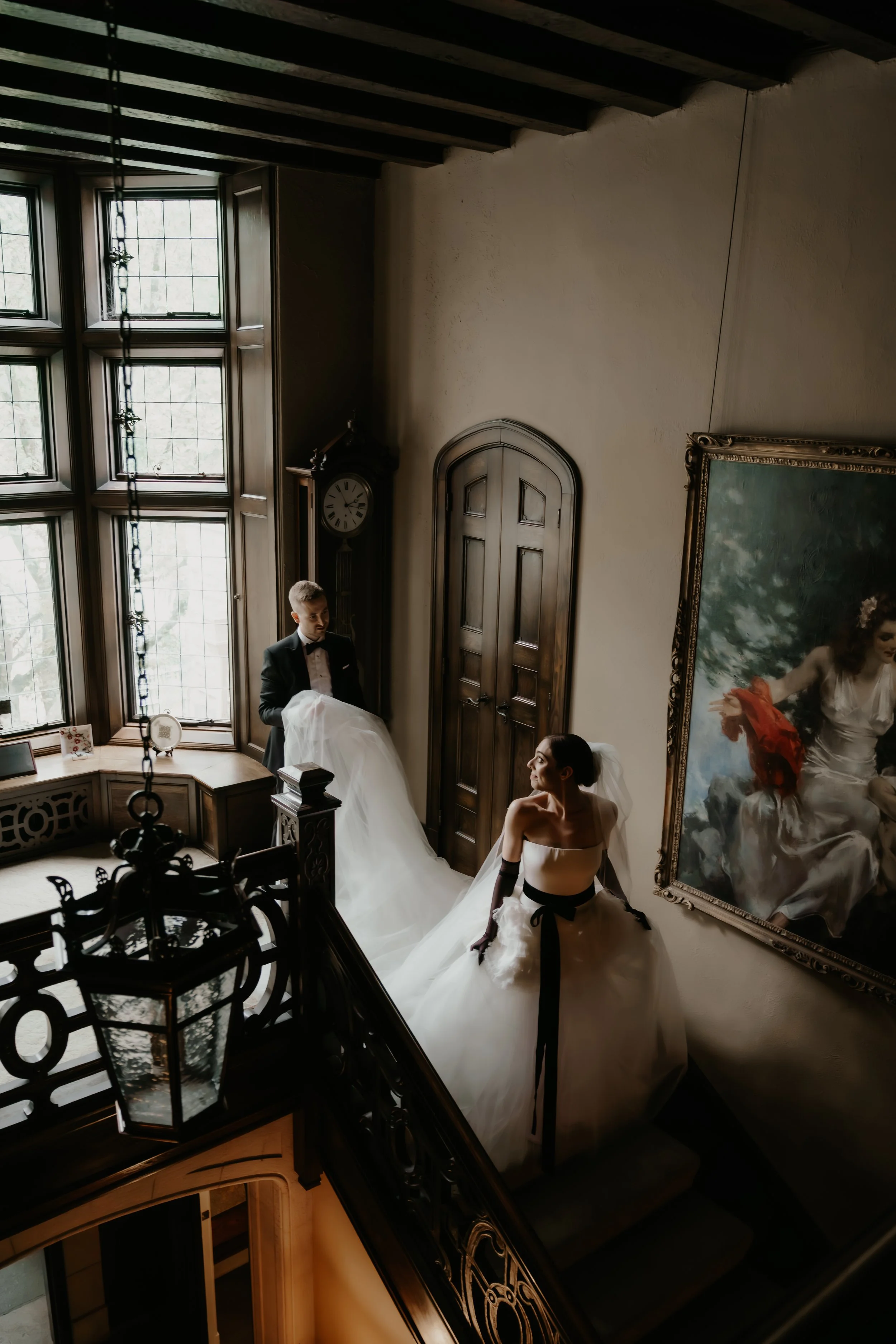 Bride and groom walking along the historic staircase inside the Ohio Governor’s Residence, photographed by Julia Brown Photo.