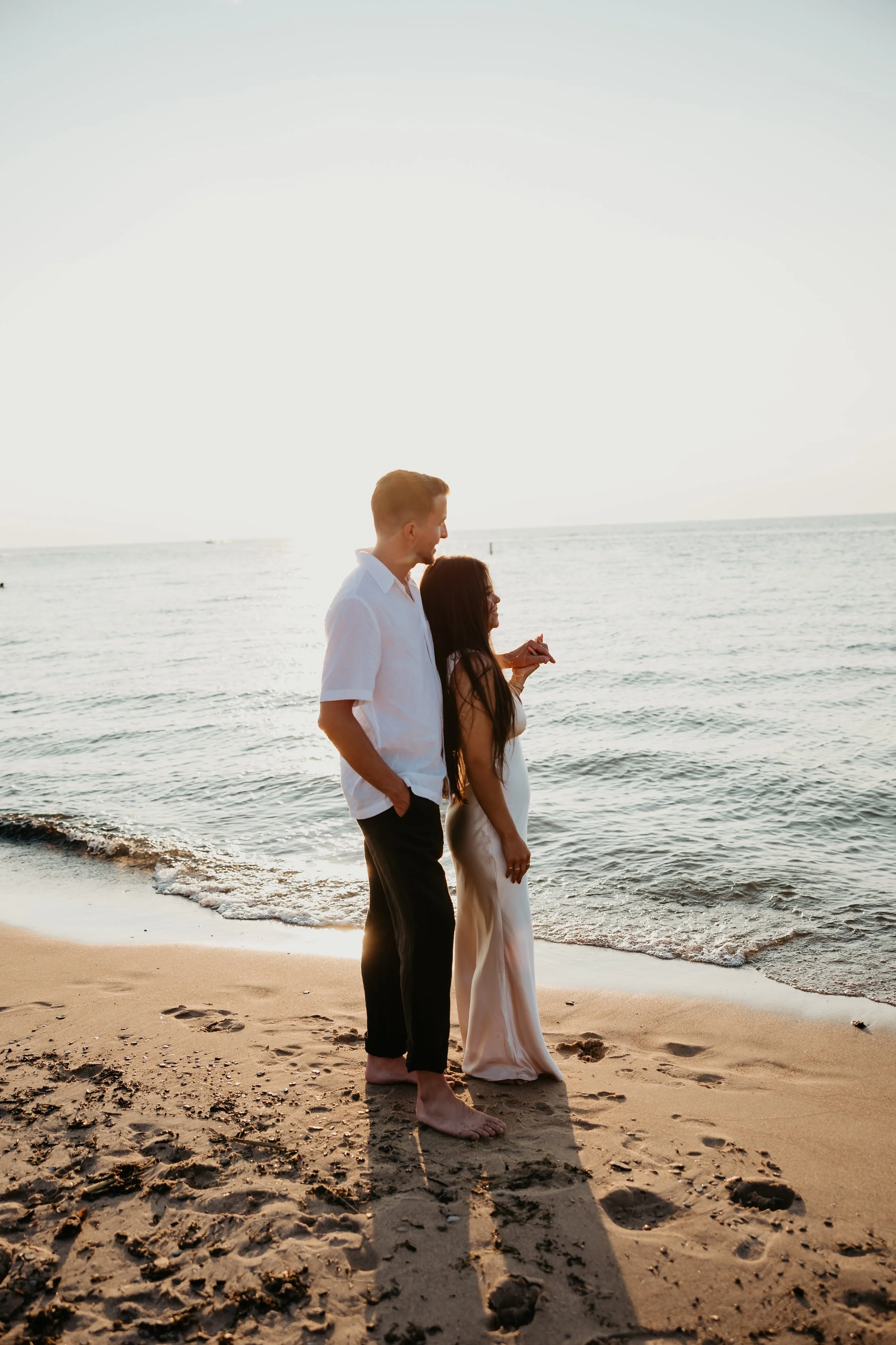 Grand Beach Sunset Engagement Photos by Julia Brown Photo