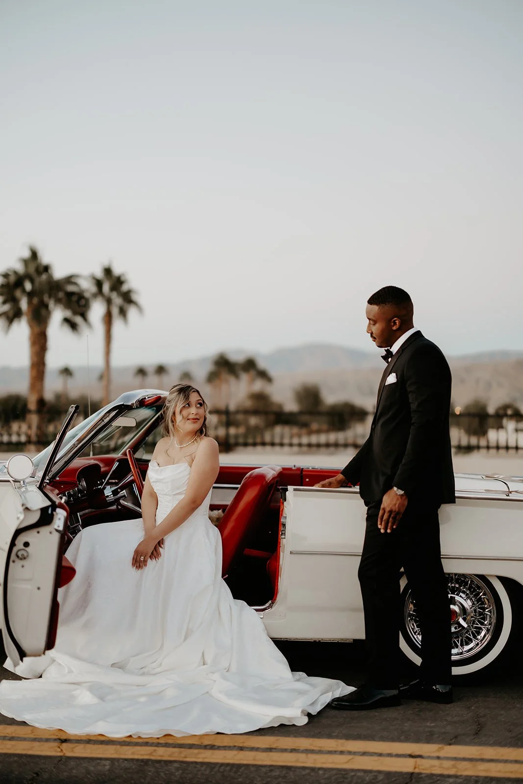 elegant-california-destination-wedding-bride-and-groom-classic-car-portrait-by-julia-brown-photo-1.jpg