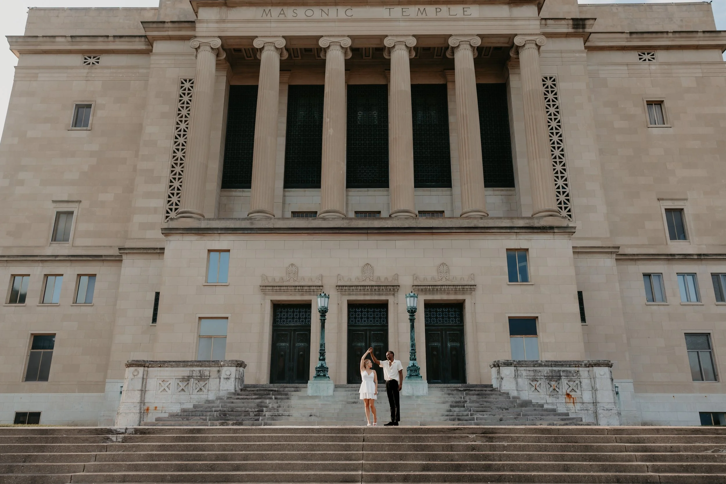 Natural Engagement Portraits Against Historic Architecture