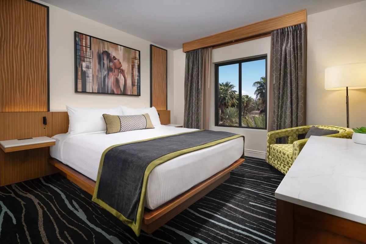2_tahiti-village-hotel-moorea-suite-bedroom-palm-tree-view-scaled.jpg