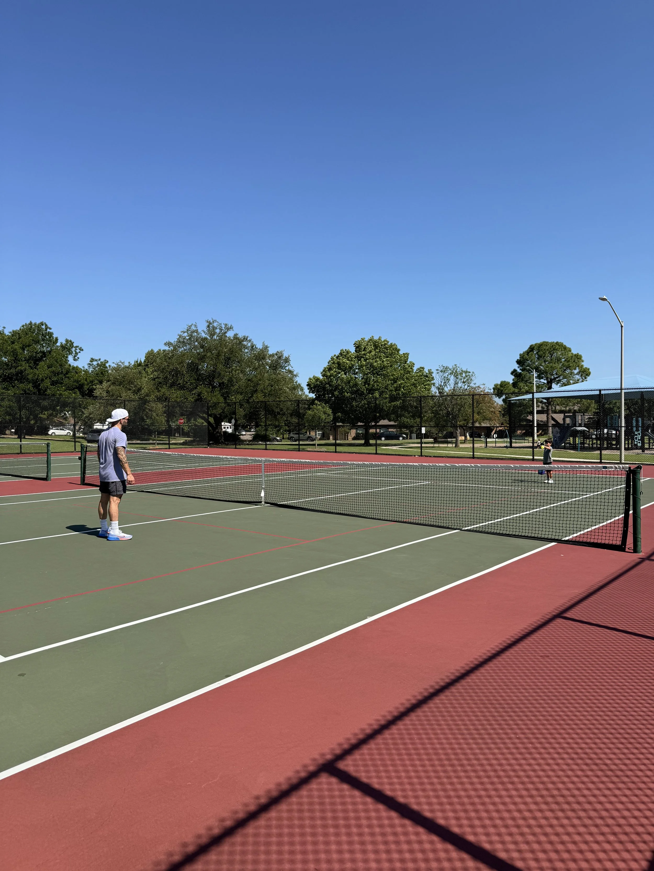Dad and Son playing pickleball