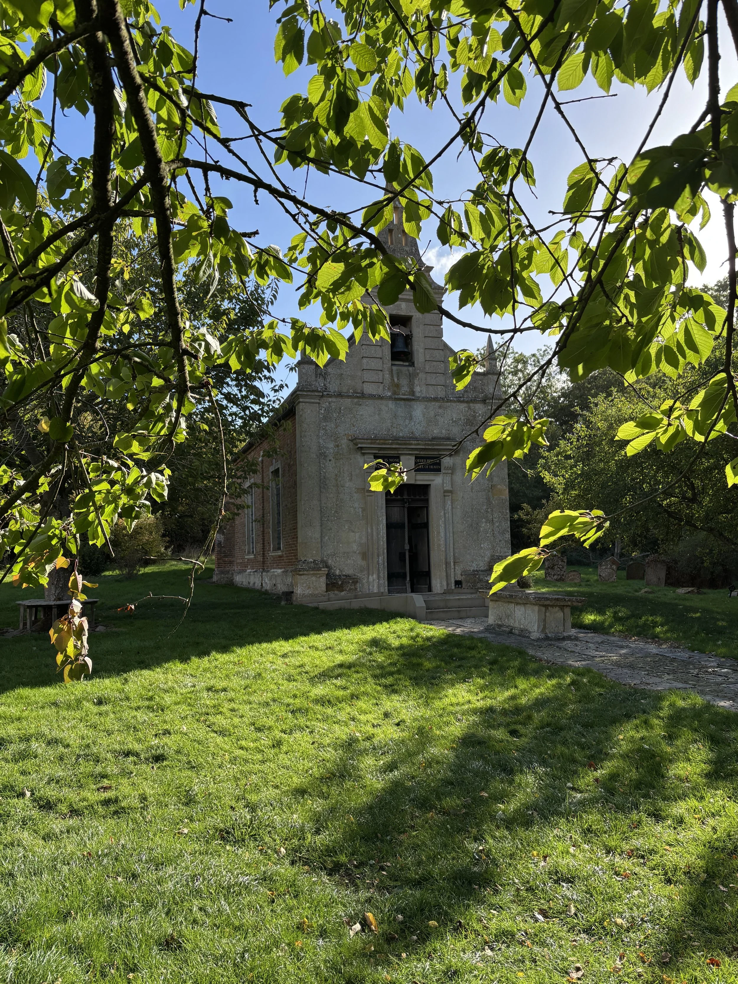 Little Gidding Church in the middle of a green garden