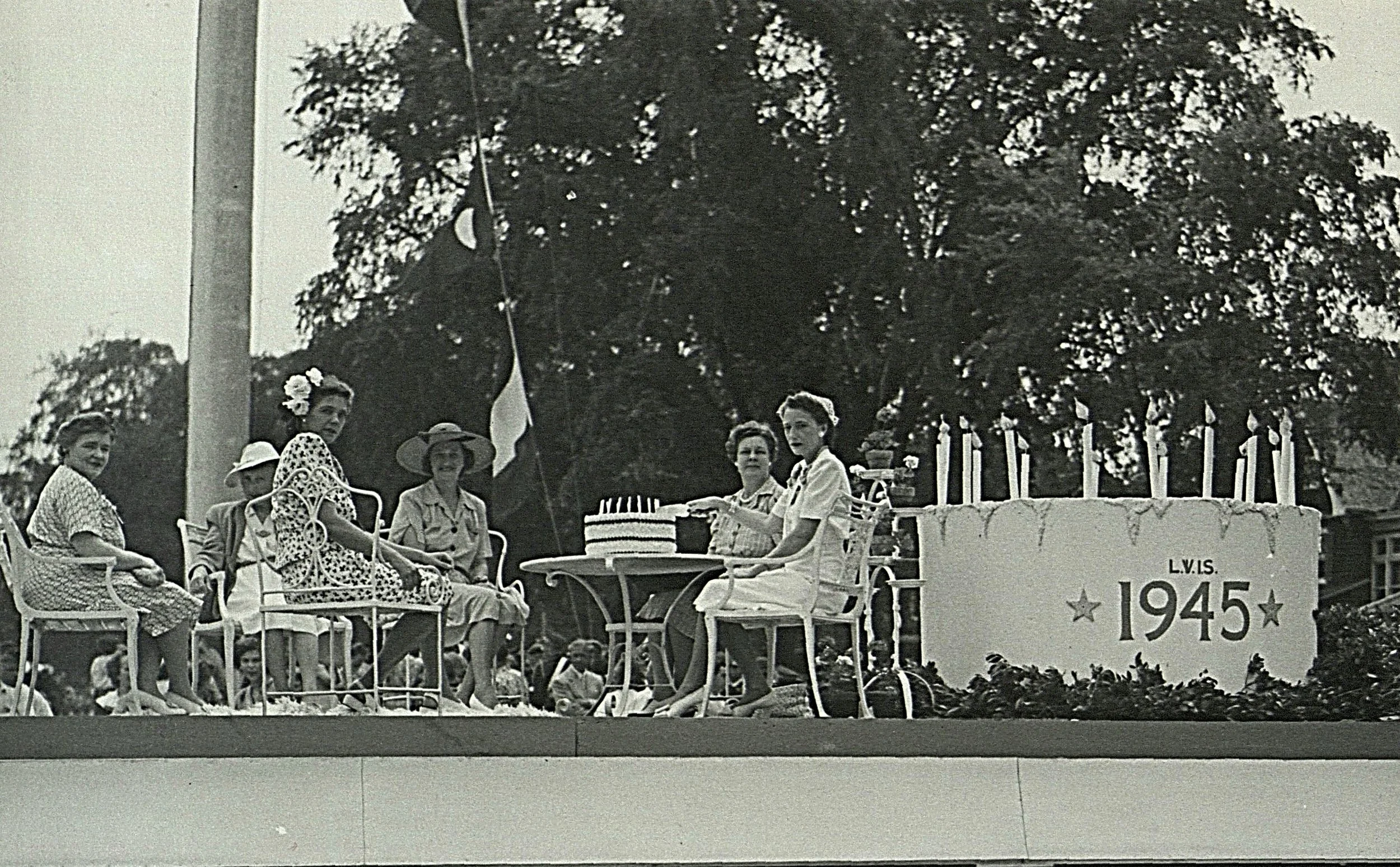 LVIS members on a cake float, 50th Anniversary