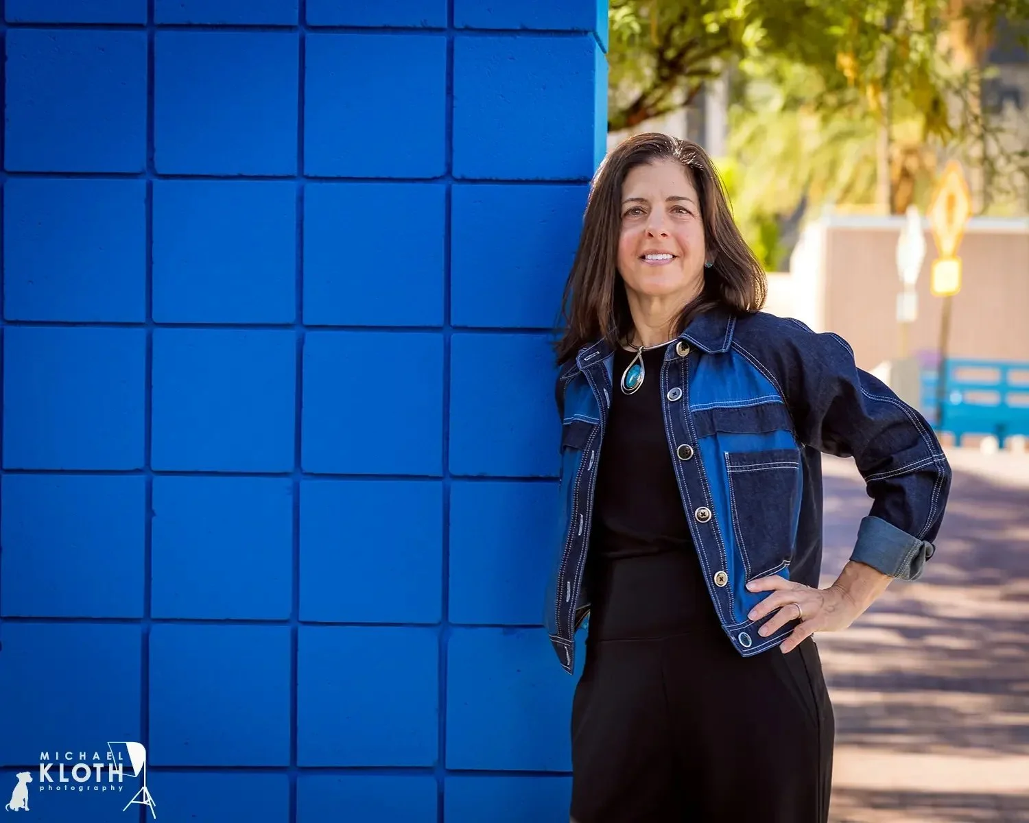 Headshot-of-a-professional-woman-at-the-Tucson-Museum-of-Art.webp