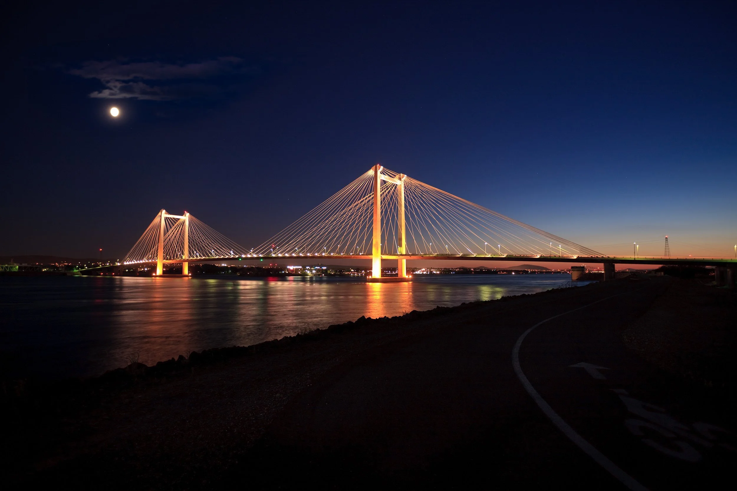 Nightrime moonrise over the Cable Bridge spanning the Columbia River between Kennewick and Pasco in the Tri-Cities, Washington.