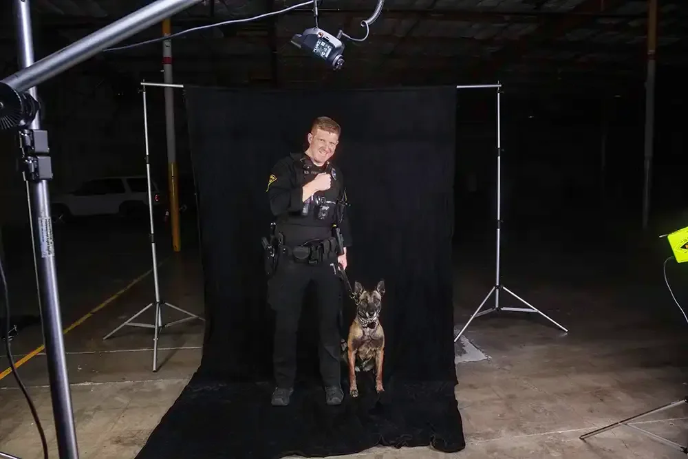 Behind the scenes - showing the mobile studio with Officer Franklin and his K9 partner