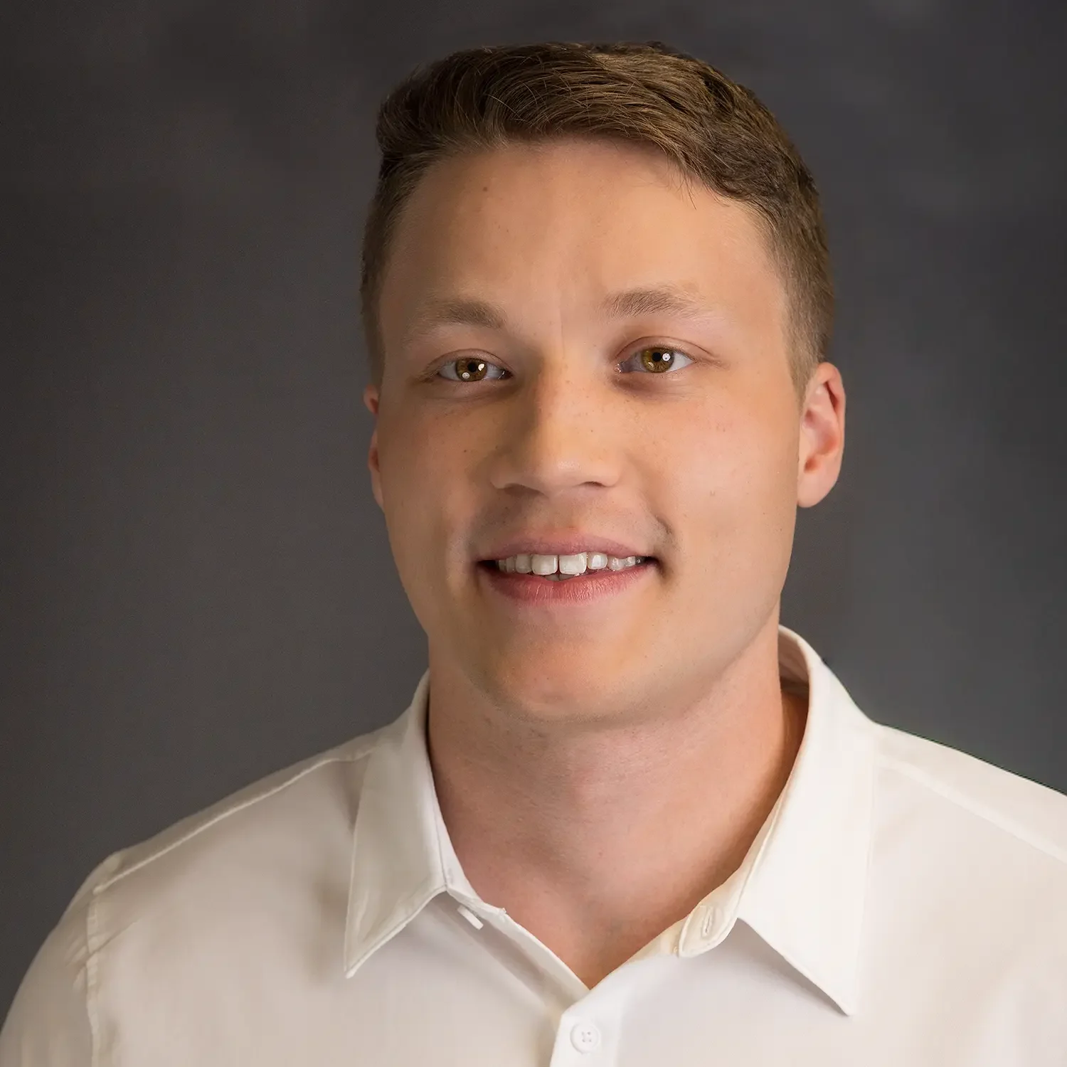A professional headshot of a young professional