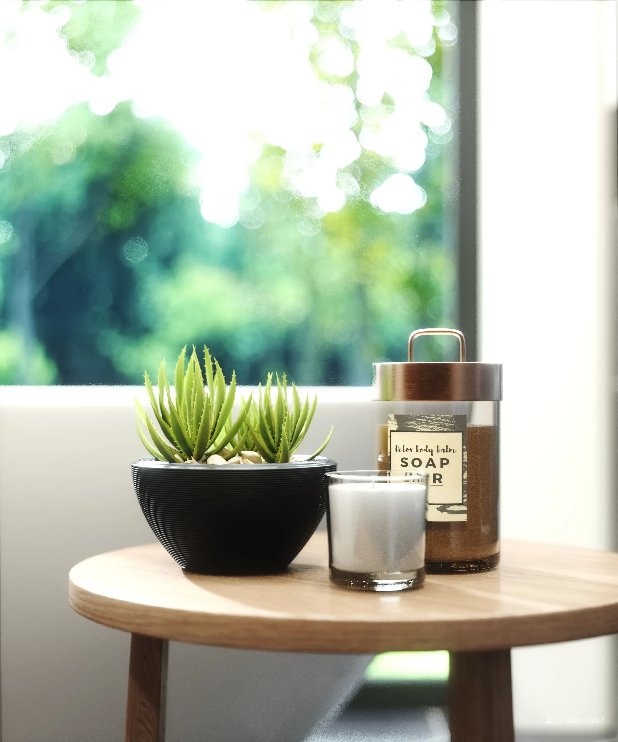 A small wooden table with a black pot of green succulents, a candle, and a jar of soap by a window with a blurred green outdoor scene.