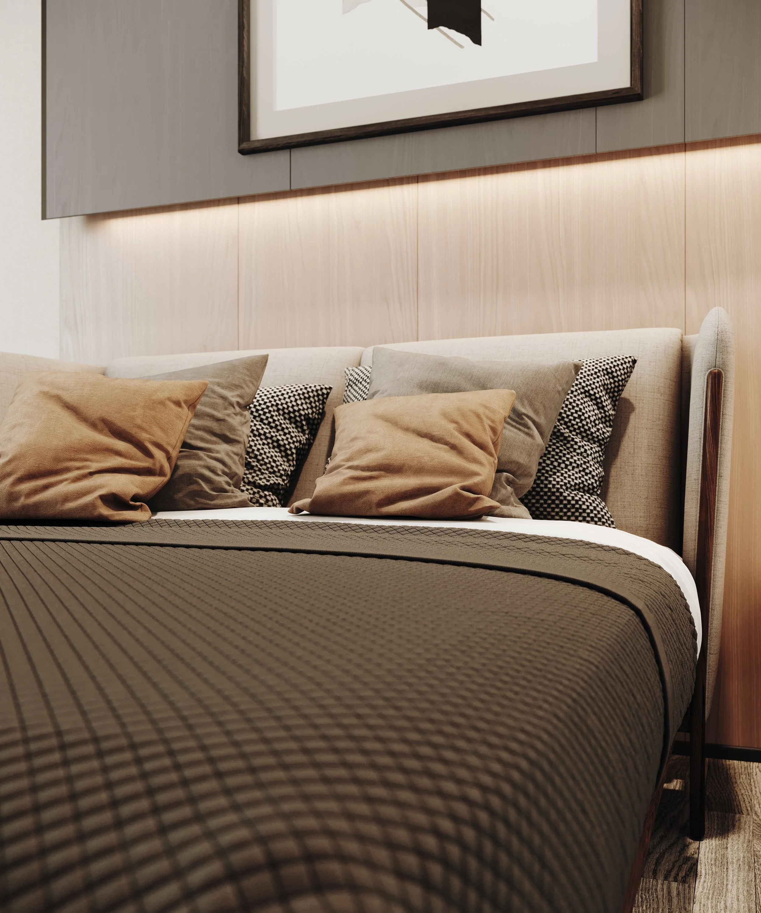 Close-up of a neatly made bed with multiple pillows and a brown textured blanket, in a modern bedroom with a wooden wall and a framed abstract artwork.