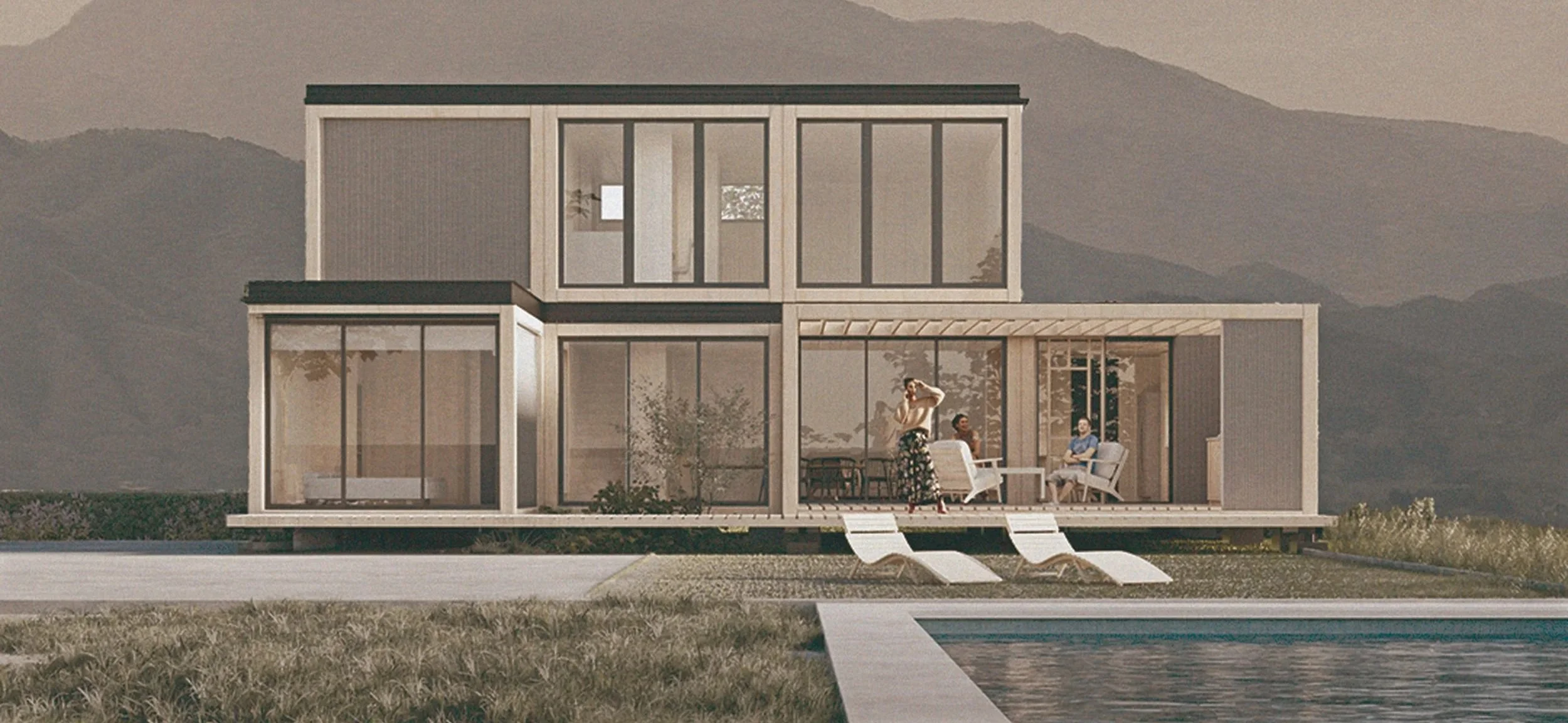 Casa moderna de dos niveles con estructura de contenedores, ventanas grandes y un área de terraza con sillas y mesas. En la terraza, hay personas conversando y una otra persona ajustándose la ropa, todo frente a una piscina y con montañas de fondo.