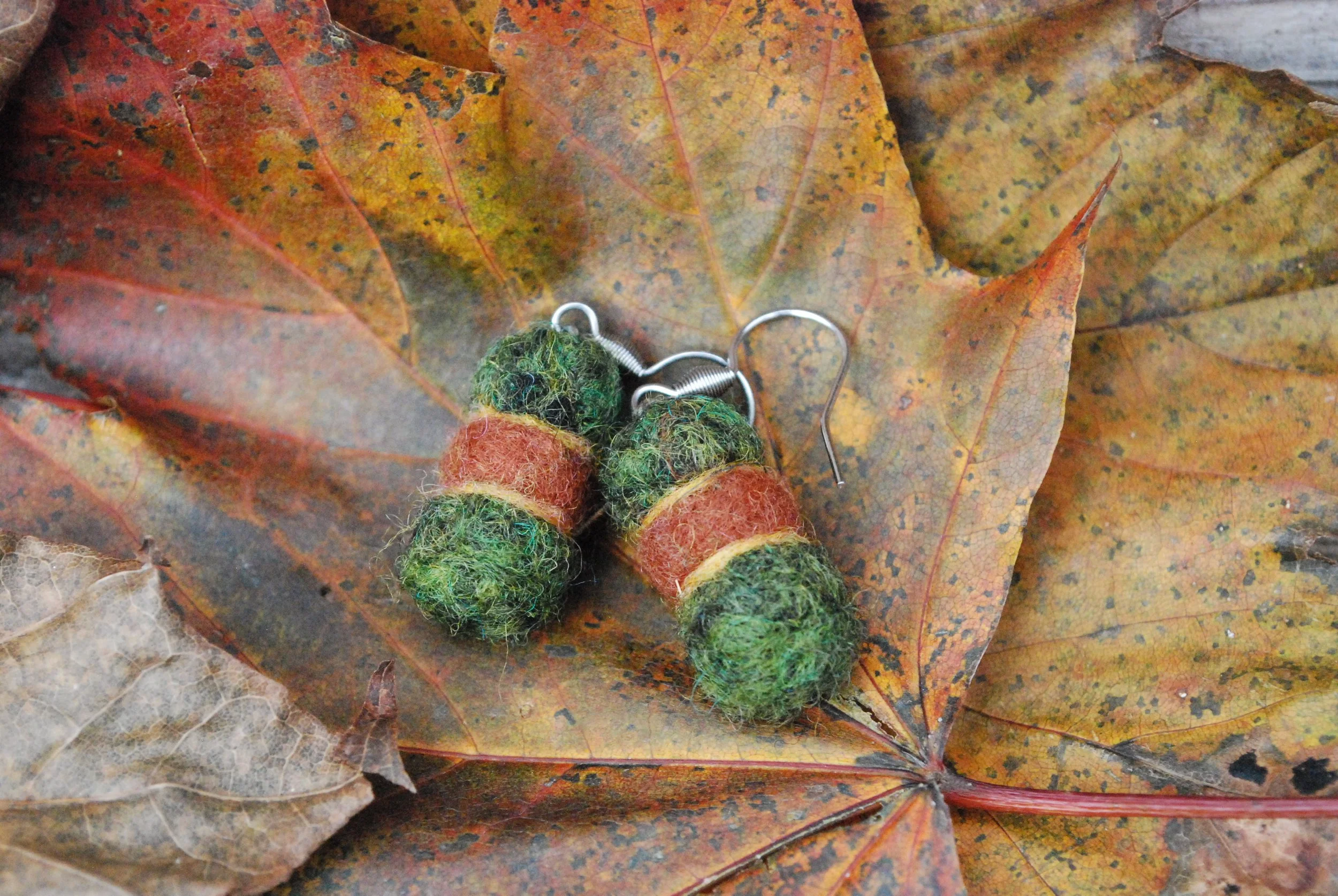 Green and brown ball earrings