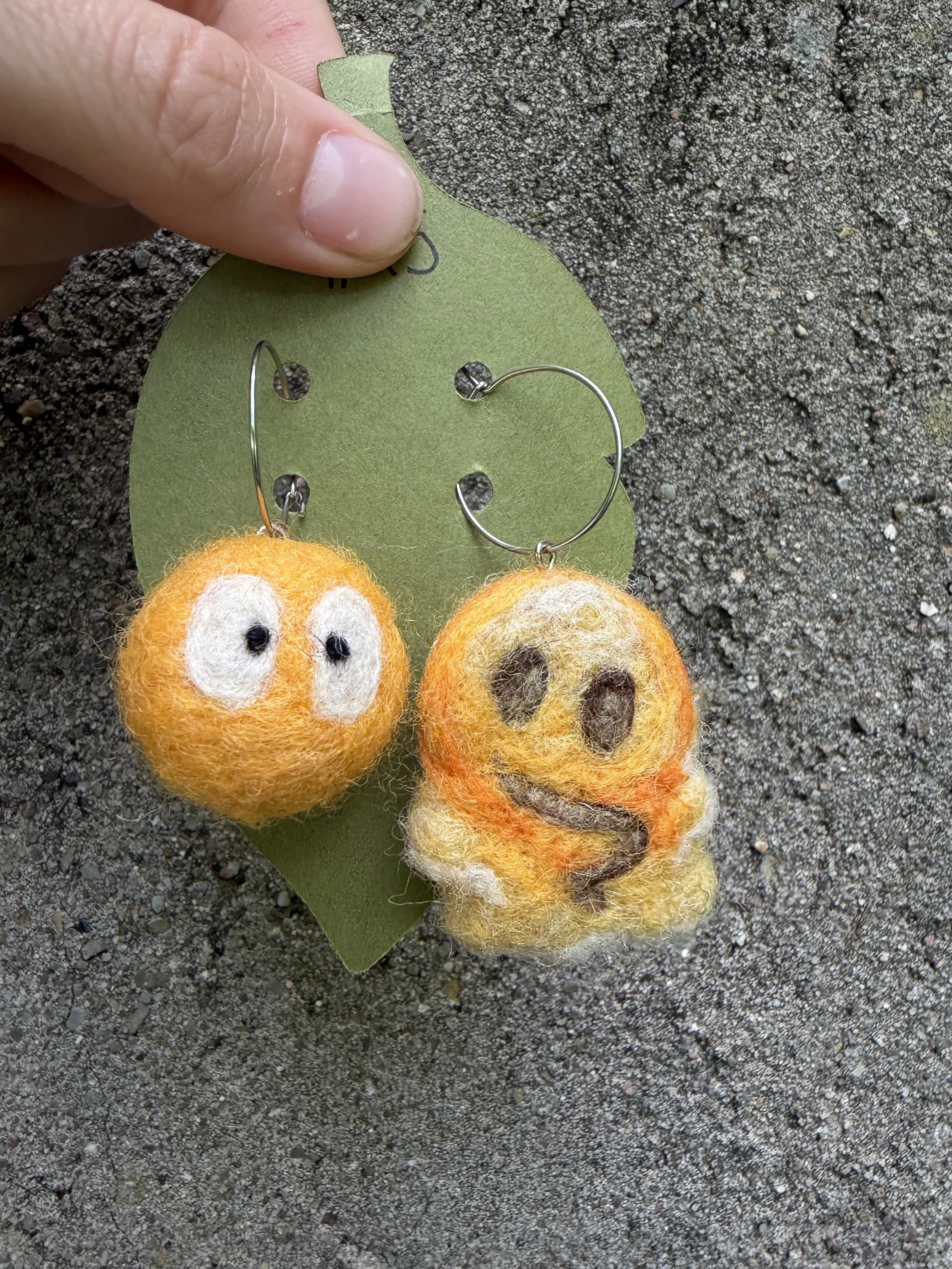 Yellow ball and melting face earrings
