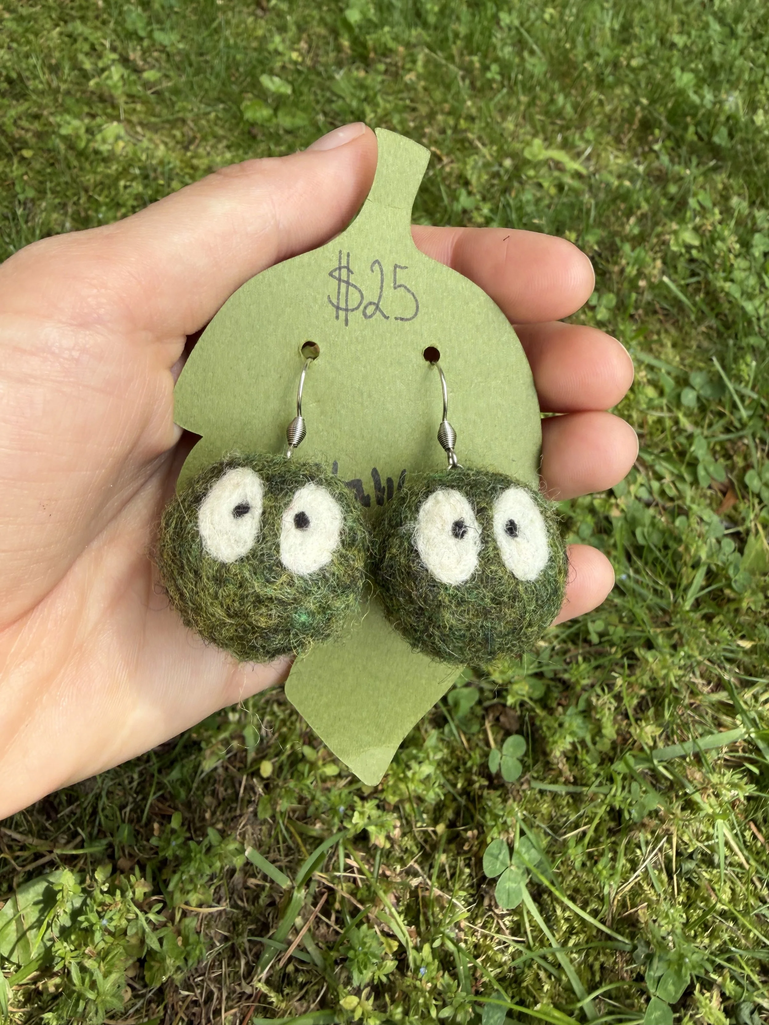 Green balls with eyes earrings