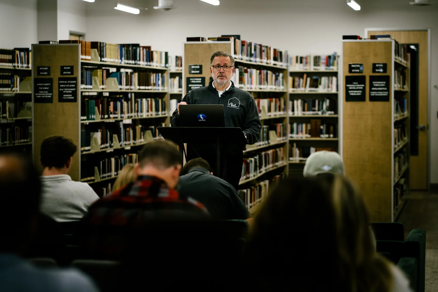 Dr. Mike Fabarez teaching students in the CBI library