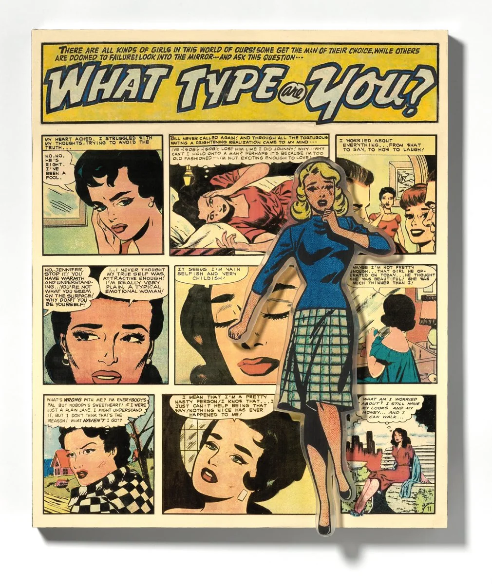 A vintage comic book page titled "What Type of You?" with colorful illustrations of women and speech bubbles, featuring a paper cutout of a woman in a blue dress placed on top of the comic.