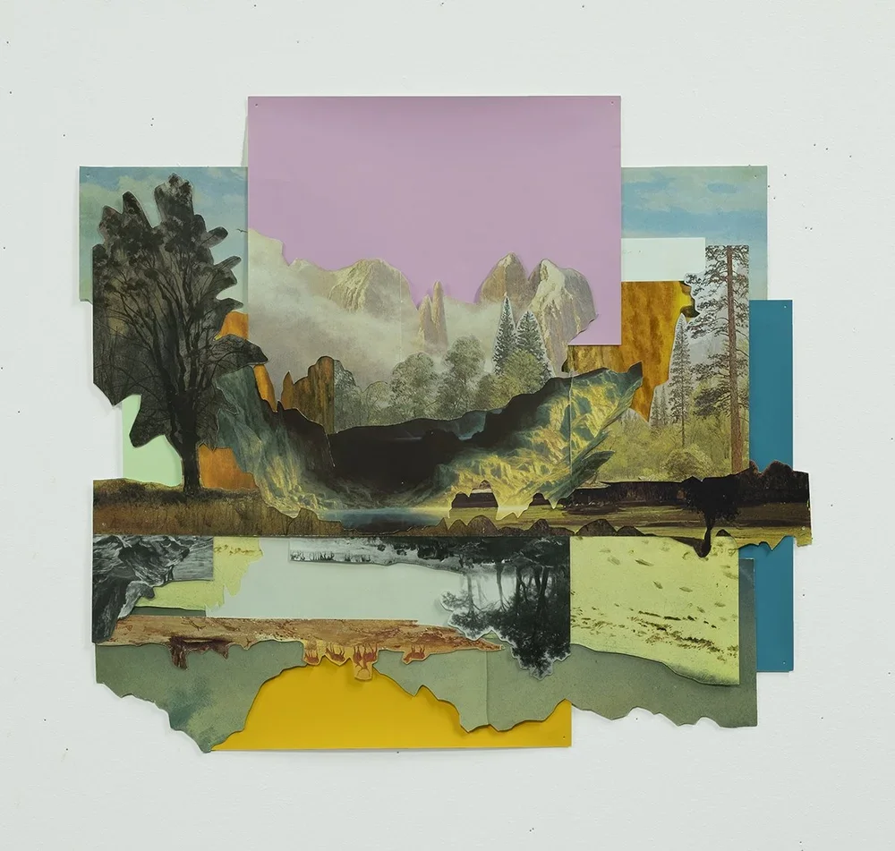 Mixed-media collage artwork depicting a landscape scene with mountains, trees, a lake, and a field, created from torn pieces of various colored and textured paper.