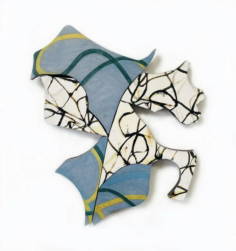 Decorative abstract art pieces with leaf and branch patterns in black and gold, painted on irregularly shaped surfaces with blue, gray, yellow, and white colors.