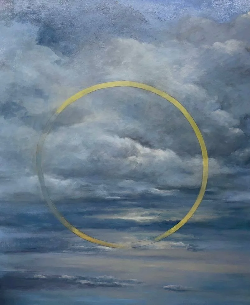 A cloudy sky with a circular yellow line overlay.