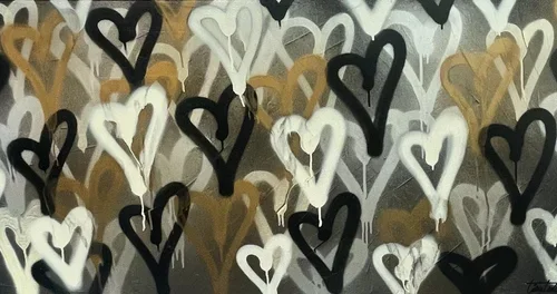 Pattern of black, white, and brown hearts painted on a wall.