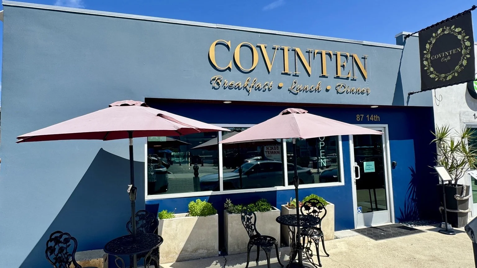 Covinten Café exterior with gold signage and patio seating in Hermosa Beach