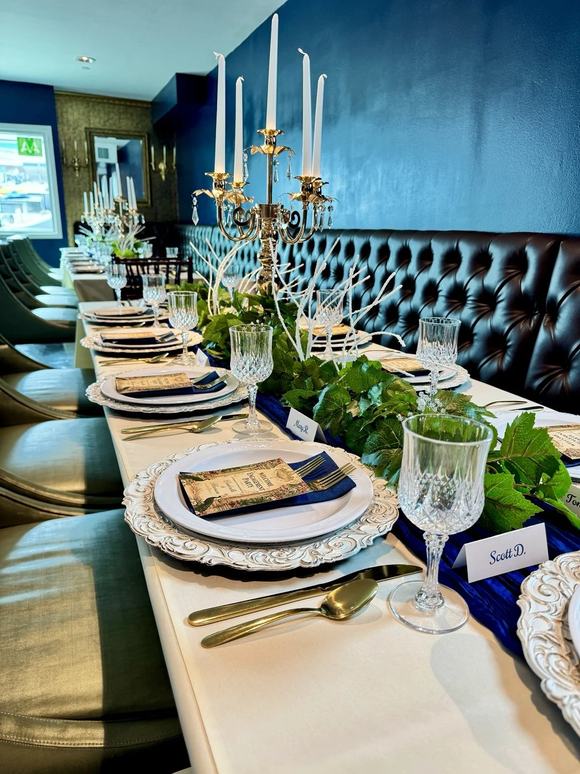 Private event table at Covinten with gold candelabras, crystal glasses and elegant place settings