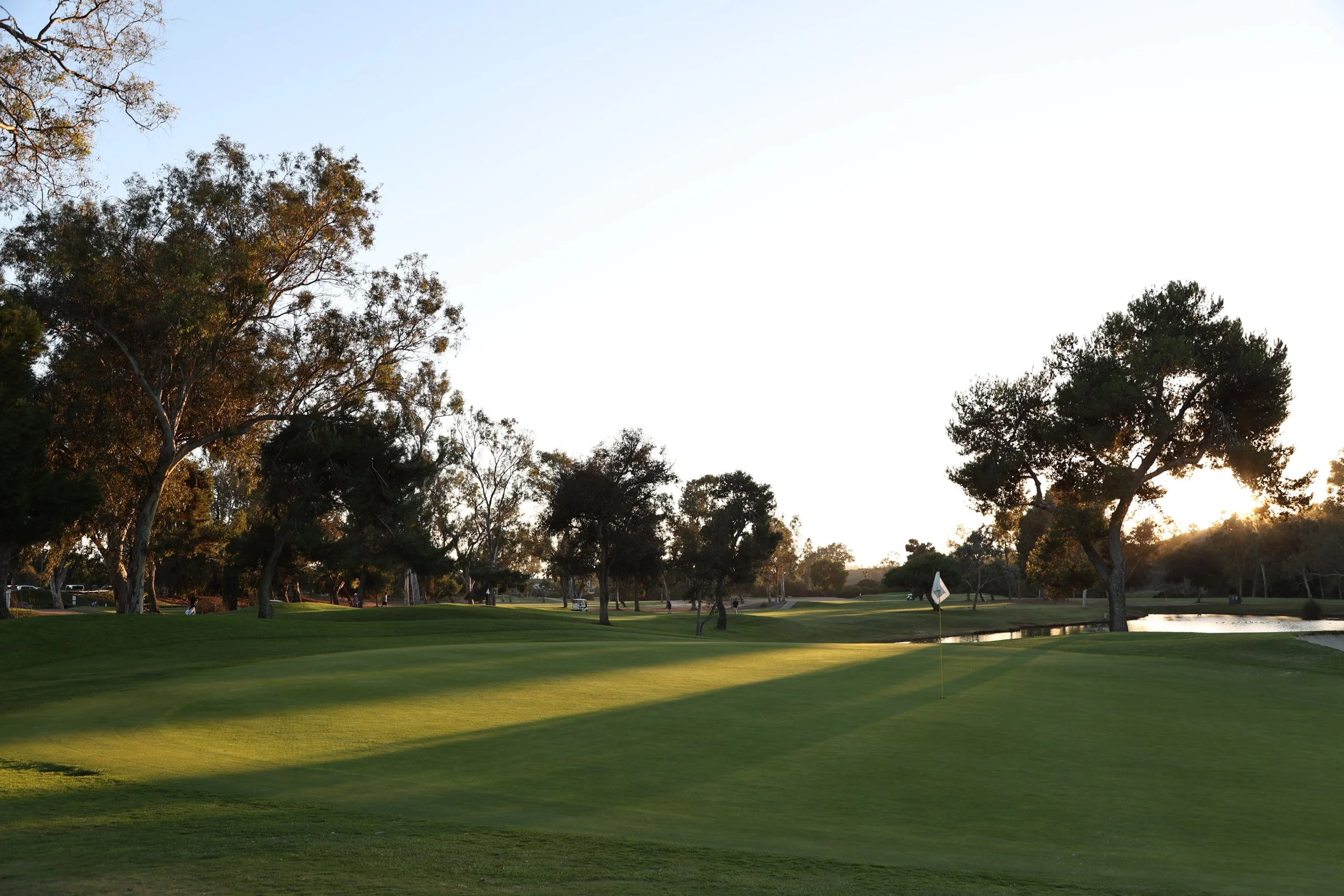 Oceanside Golf Course putting green and lake at dusk