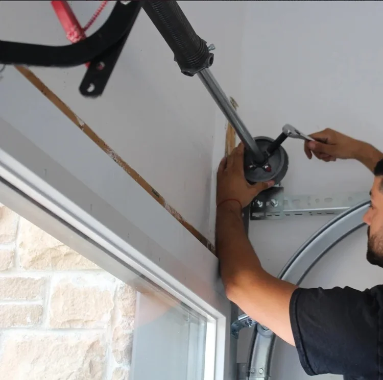 Garage door technicians performing service work