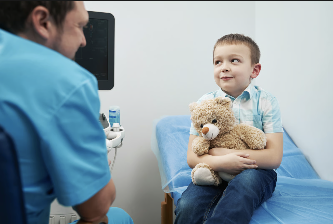 Kid speaking with nurse.