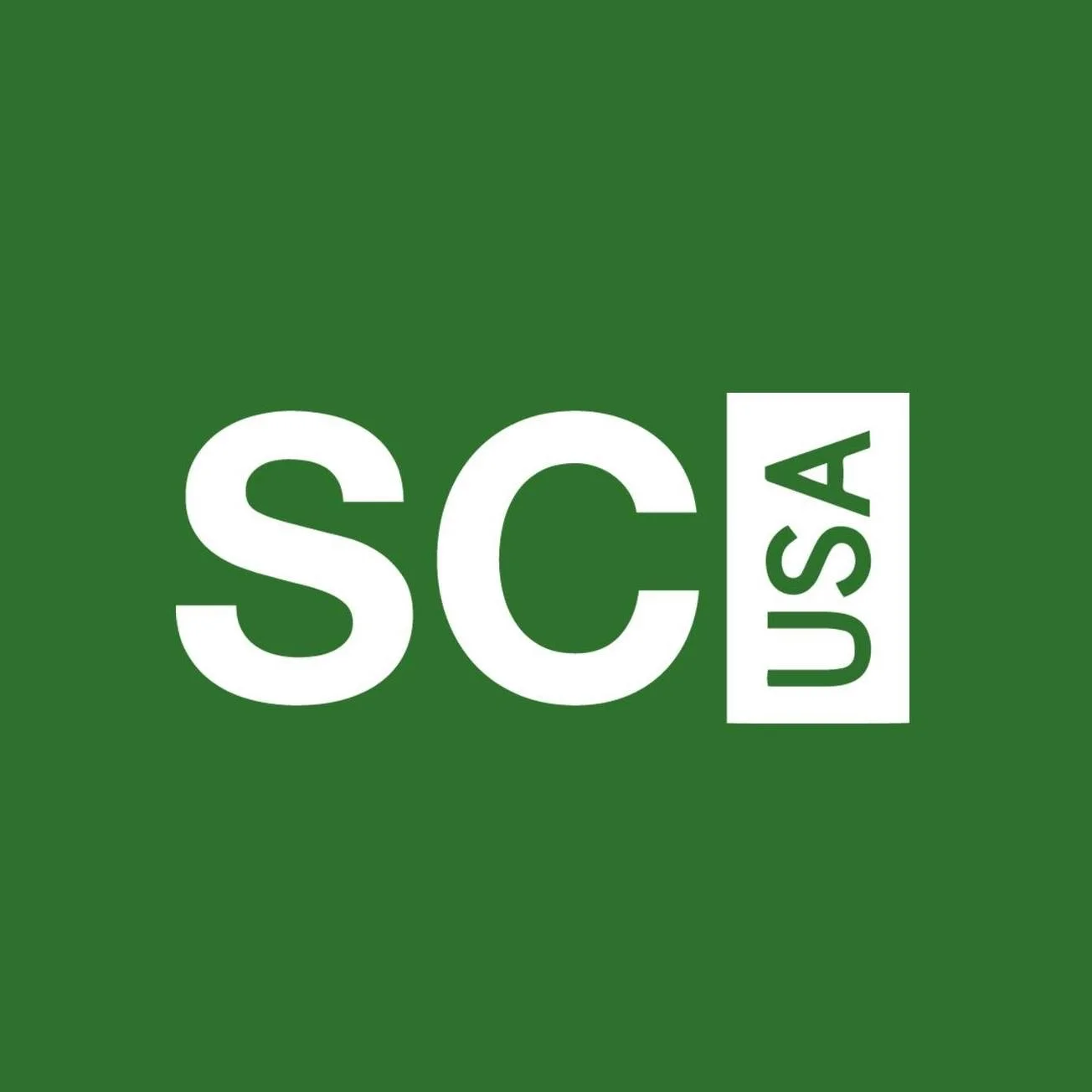 The logo of Scrubs USA featuring white text on a green background, with 'SCRUBS' in large letters and 'USA' in smaller letters vertically aligned.