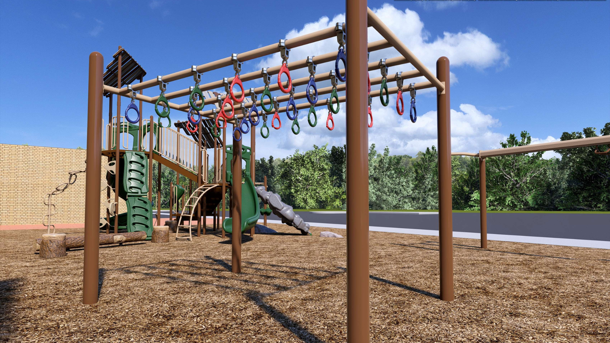 Playground with climbing structures and monkey bars on wood chip ground under a blue sky with clouds