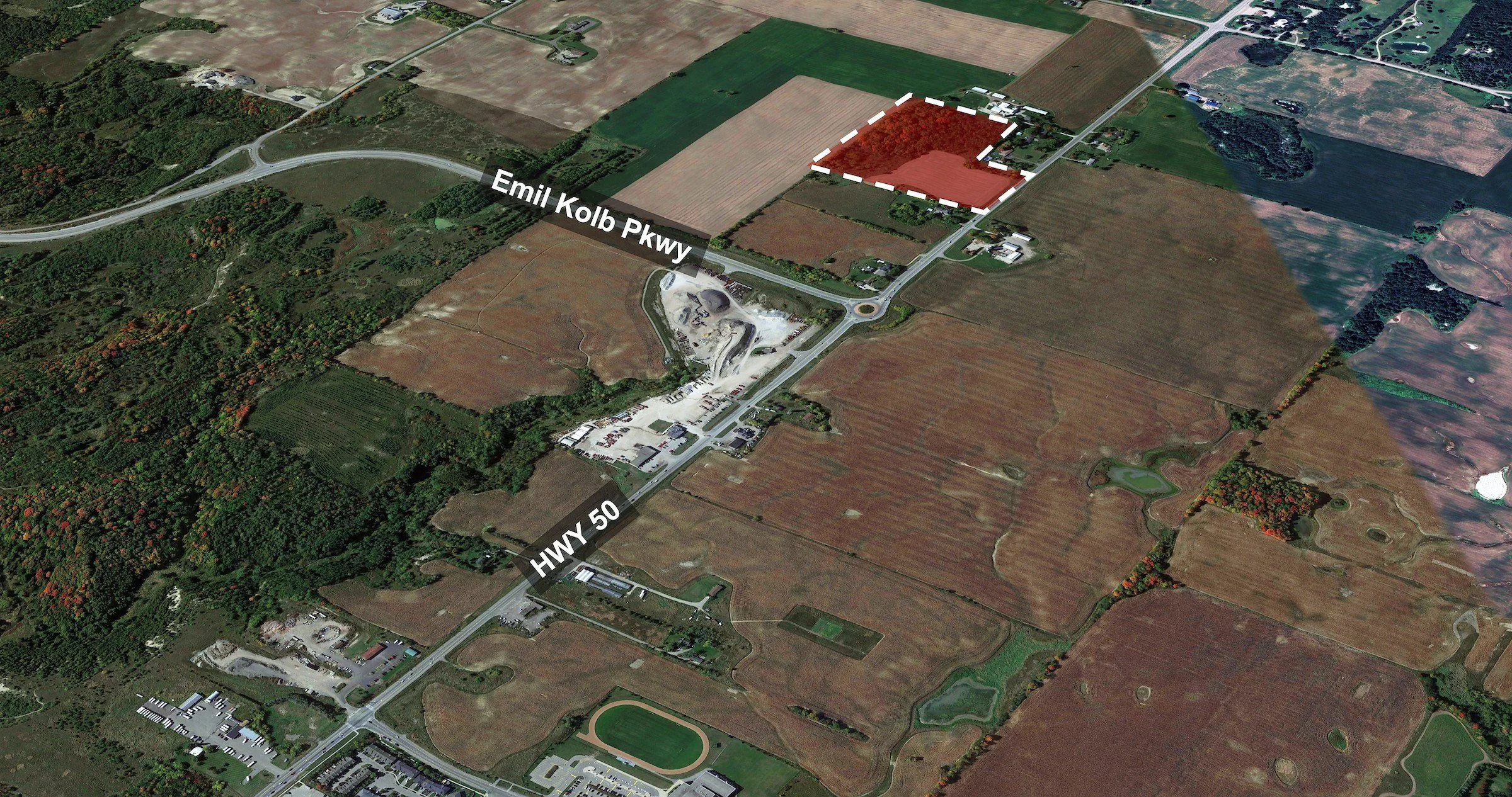 Aerial view of 14700 Highway 50 in Bolton, Caledon, with the 21-acre site outlined in red north of Emil Kolb Parkway along Highway 50.