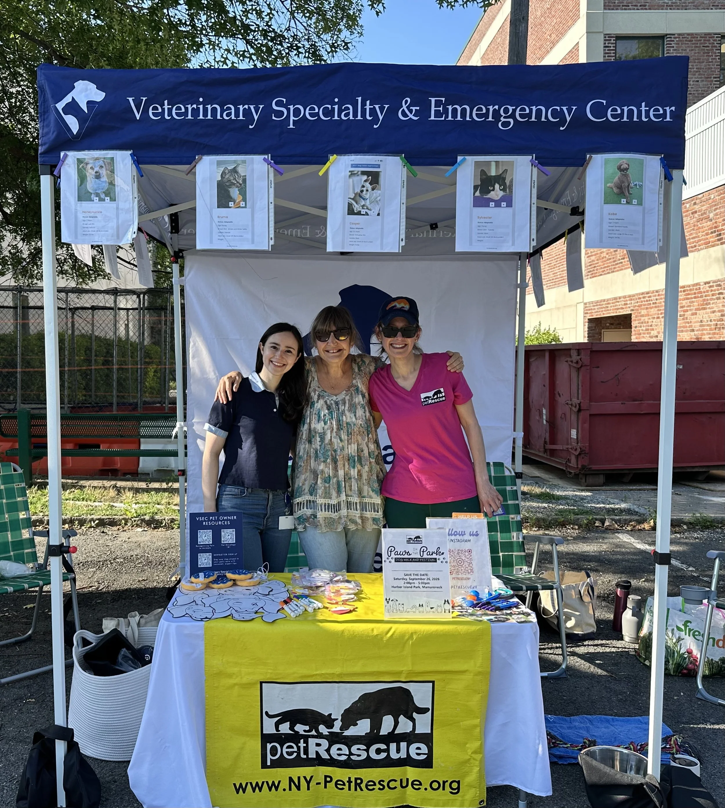 VSEC and Pet Rescue sharing a booth at a farmers market event