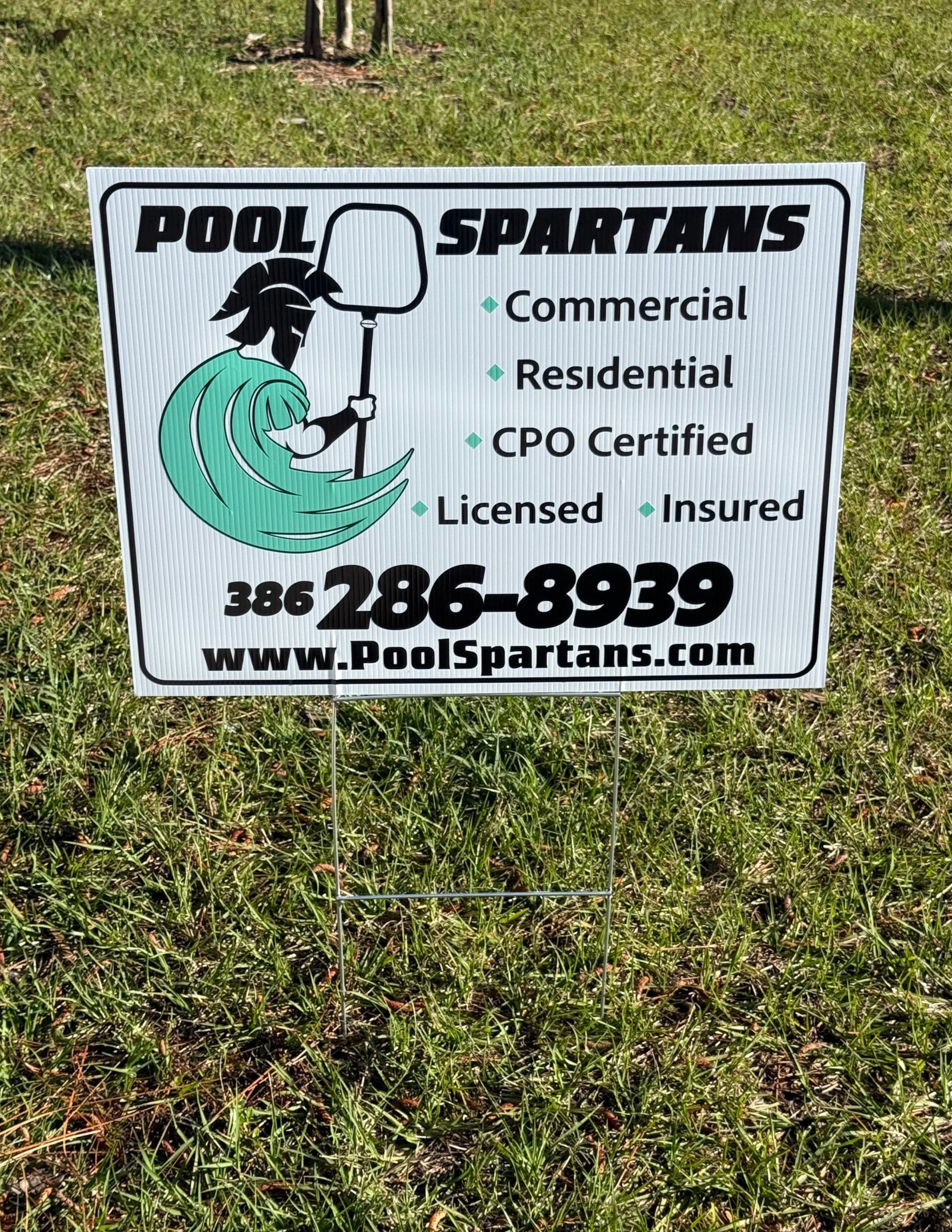 Yard sign with steak advertising a local pool cleaning company