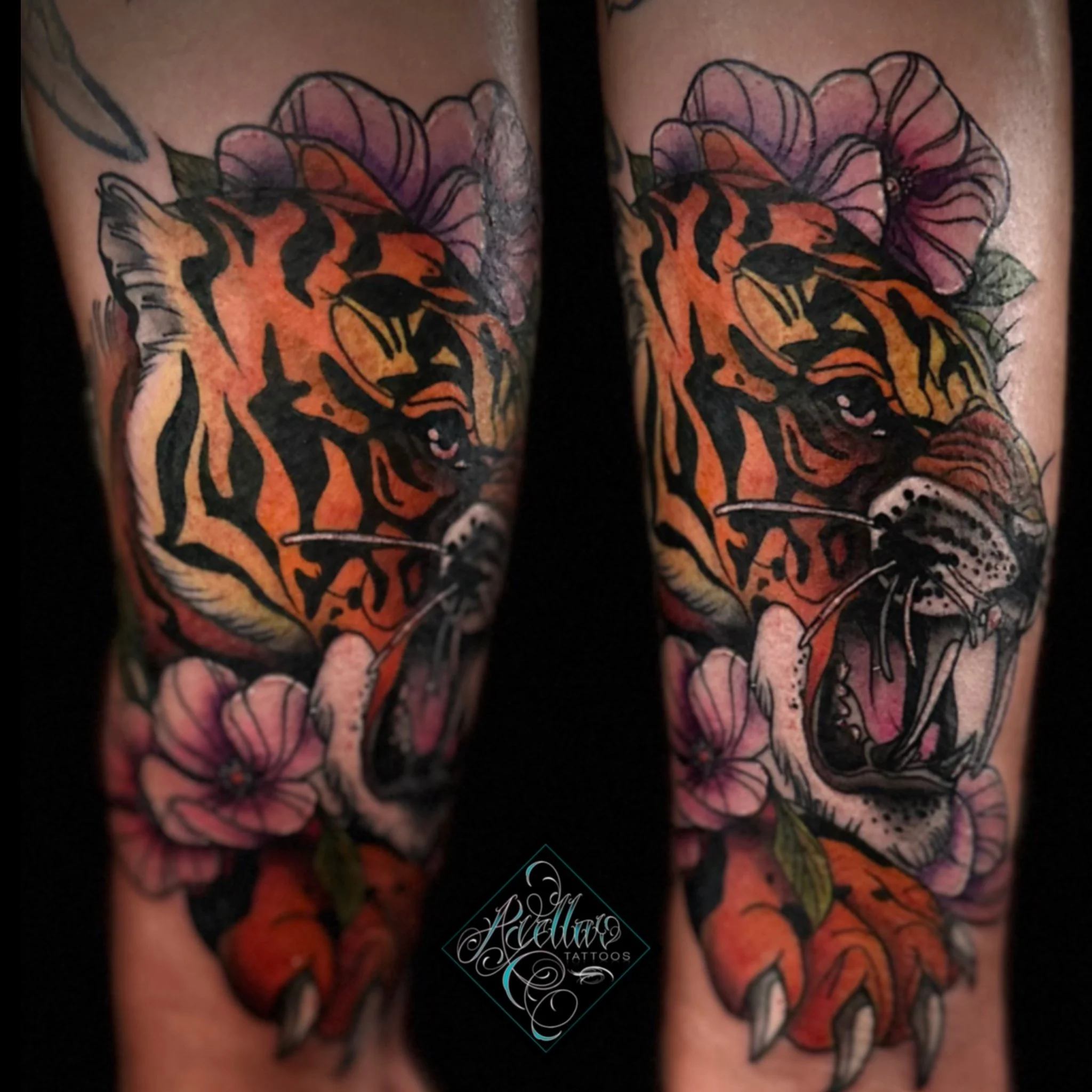 Tattoo of a tiger's face surrounded by pink flowers on a person's arm.