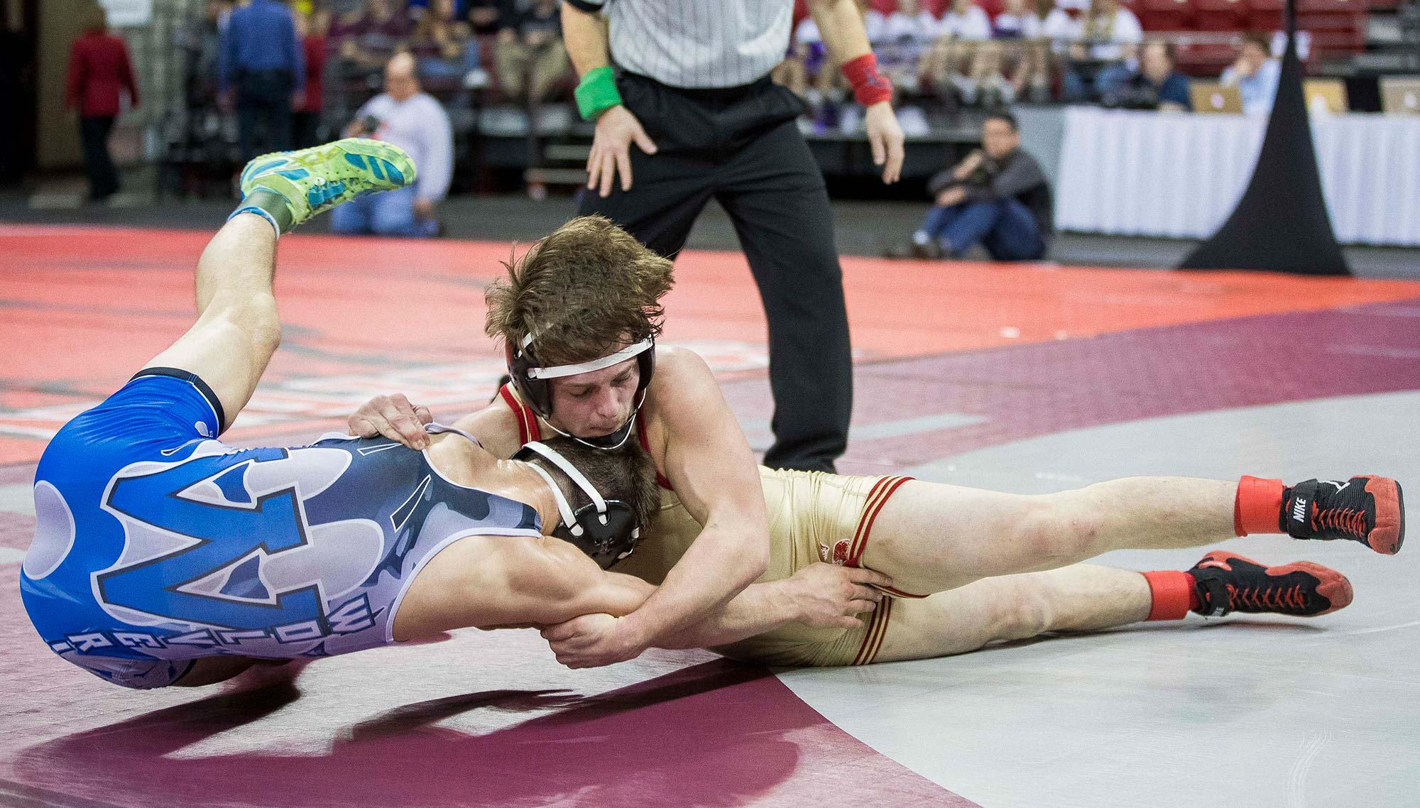 Marshfield wins final five matches to defeat Spartans 41-24