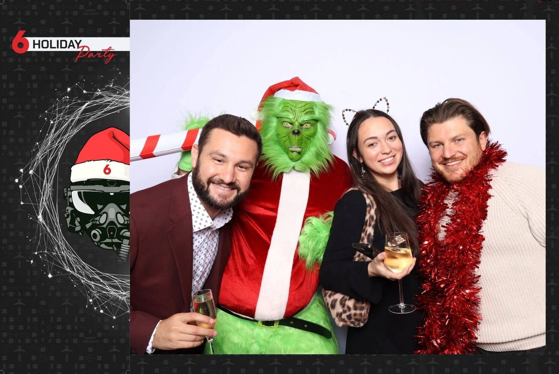 A young woman with long, wavy blonde hair standing against a plain white wall, wearing a black jacket over a white dress.
