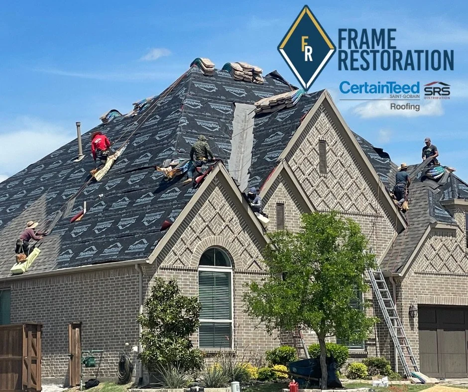 Workers reroofing a house, part of frame restoration, using CertainTeed roofing materials, with company logos visible.
