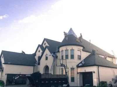 Victorian-style home in Utah with steep gable roof and turret, ideal for specialized roof replacement services
