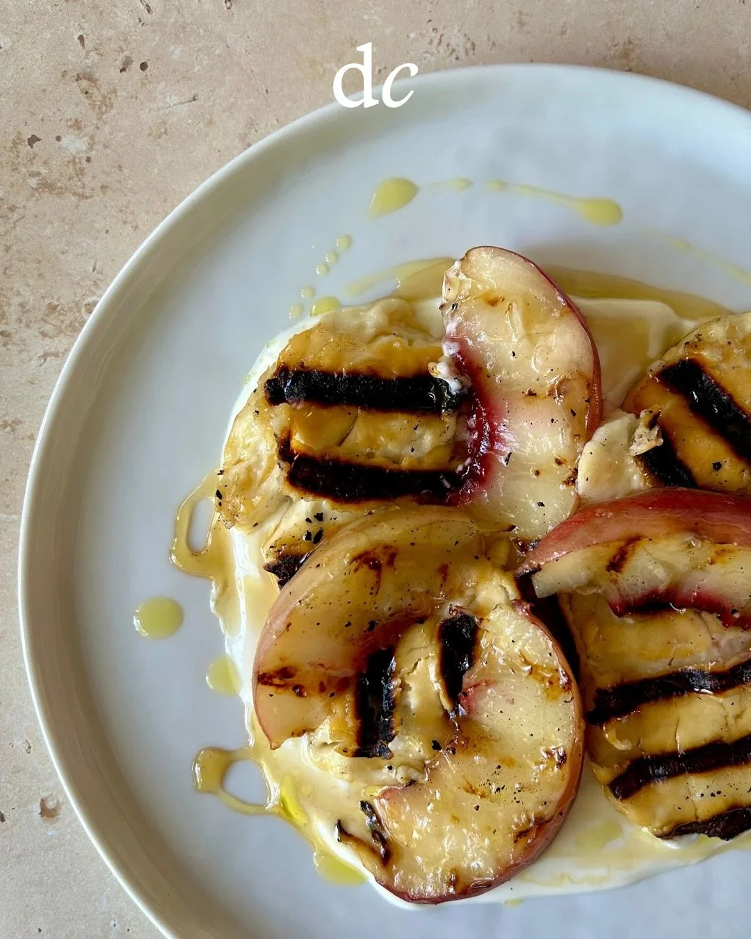 Grilled peach &amp; halloumi over lemon yogurt with rosemary honey 🍑

a hit from my last #CravesCollective, live on substack tonight (along with musings about peaches, seasonal cooking, and wine!) &mdash; link in bio!