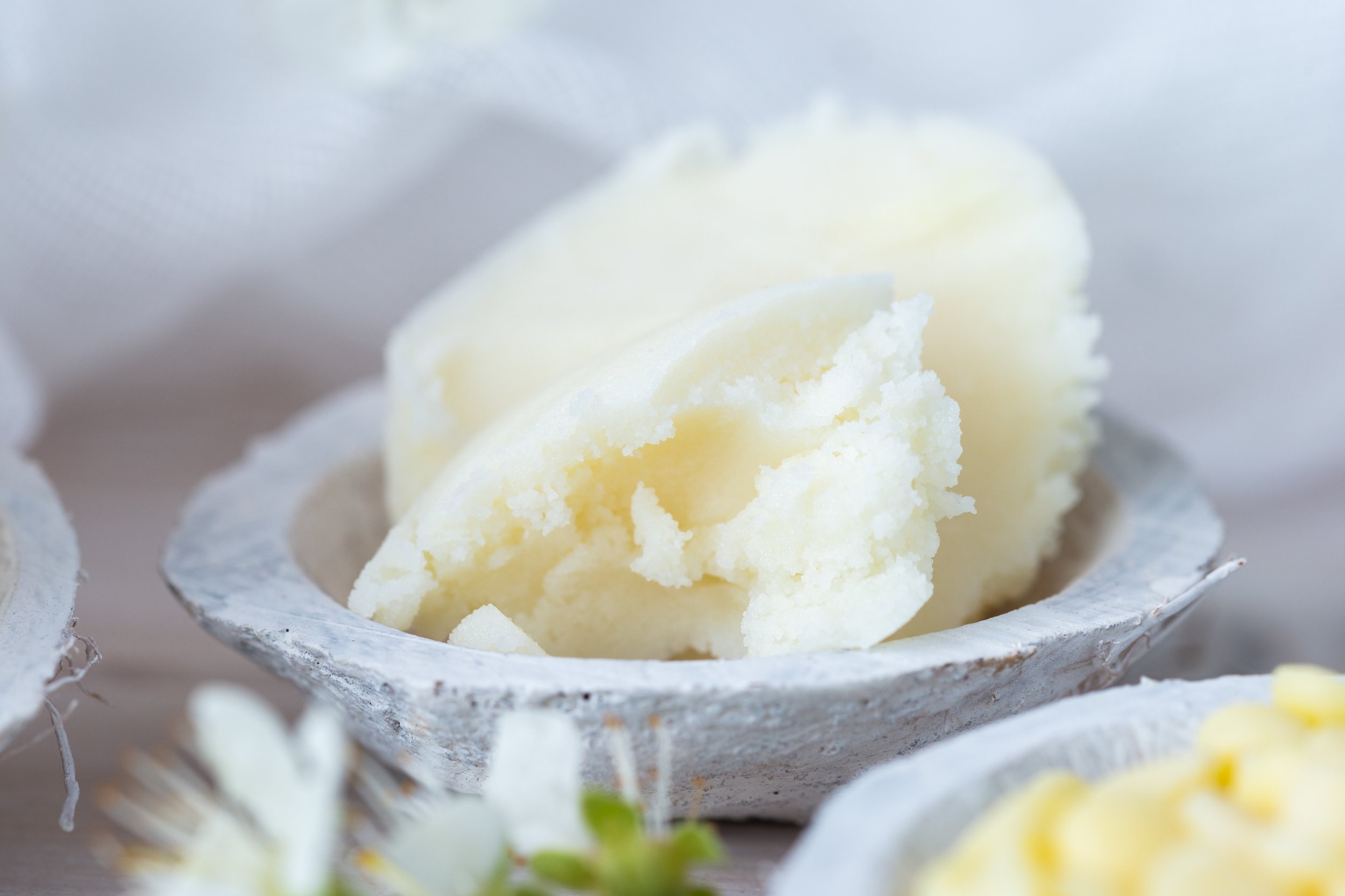 shea-butter-in-small-bowls-with-spring-flowers-2026-03-18-05-43-00-utc.jpeg