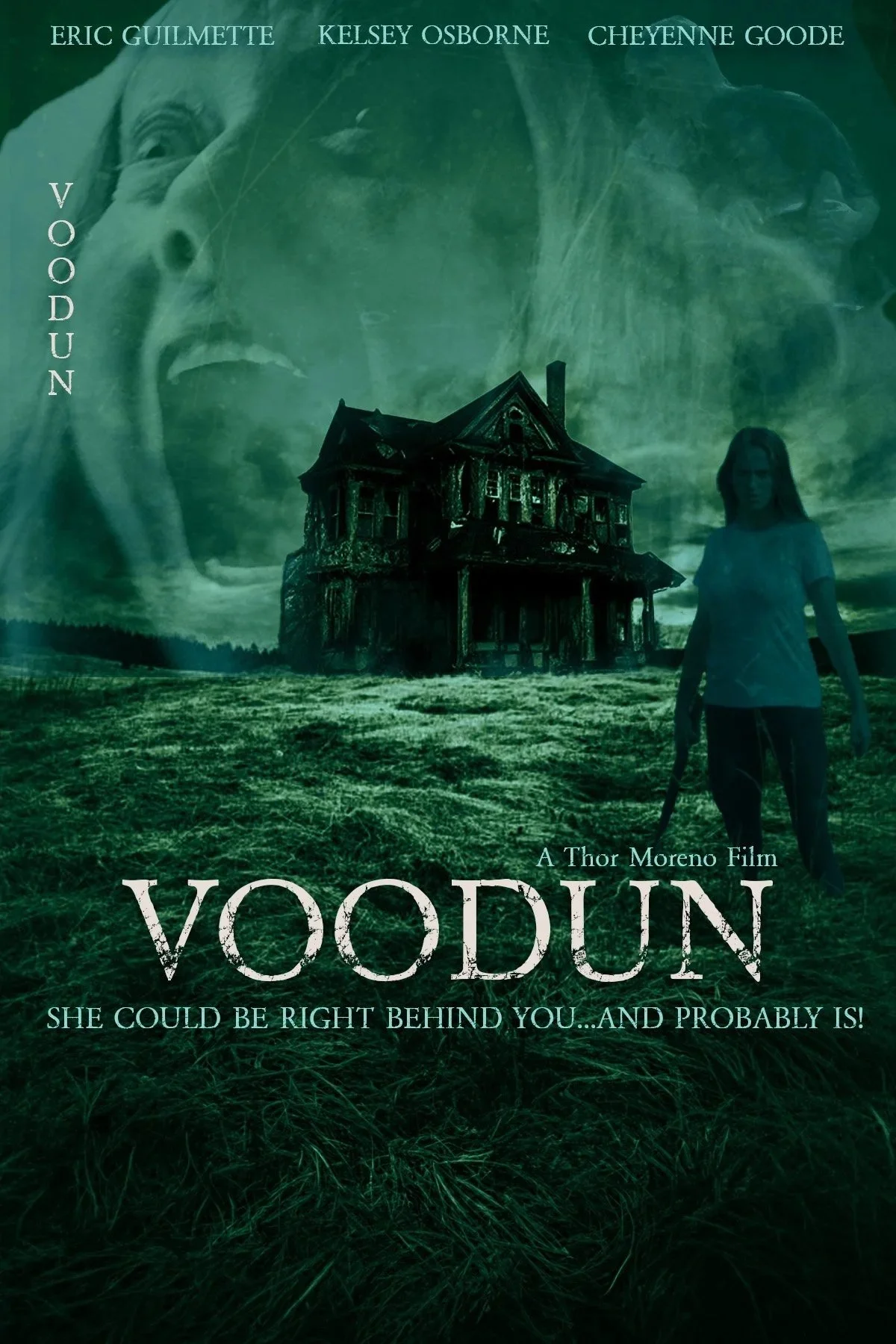 A promotional movie poster for 'Voodun,' featuring a dark, spooky house in the background, a young girl with long hair and a serious expression, a large ghostly face of a screaming woman overlayed in the sky, and eerie greenish tones with the tagline 'She could be right behind you... and probably is!'