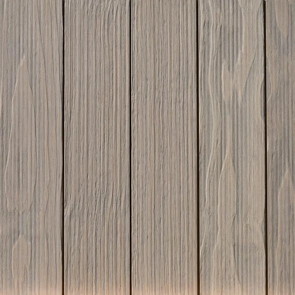 Close-up of a wooden surface with vertical planks and visible wood grain.
