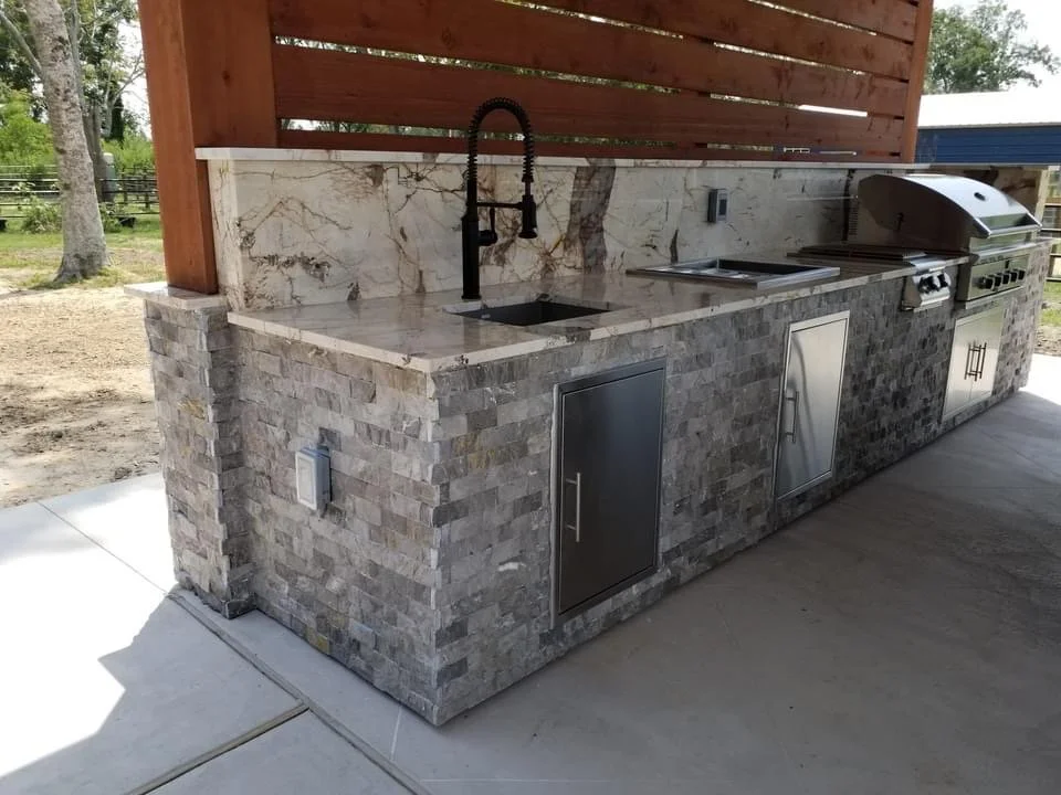 outdoor kitchen , ledgestone, grill and appliances