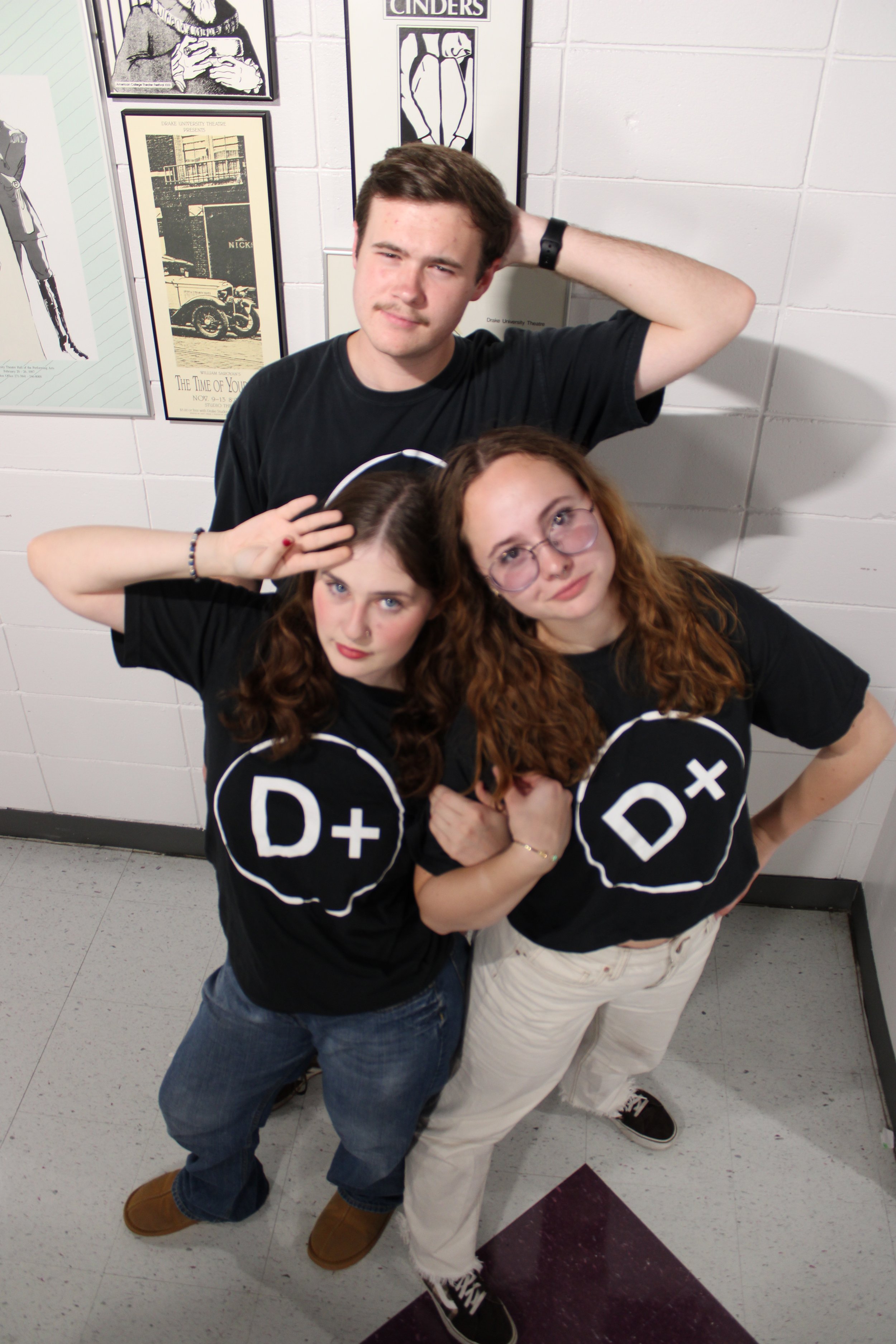 Poster photoshoot with members posing.