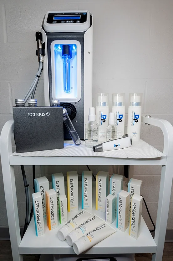 HydraBrasion machine on display with Dp4 micrneedle and DermaQuest skincare sold at Skinfinite Glow