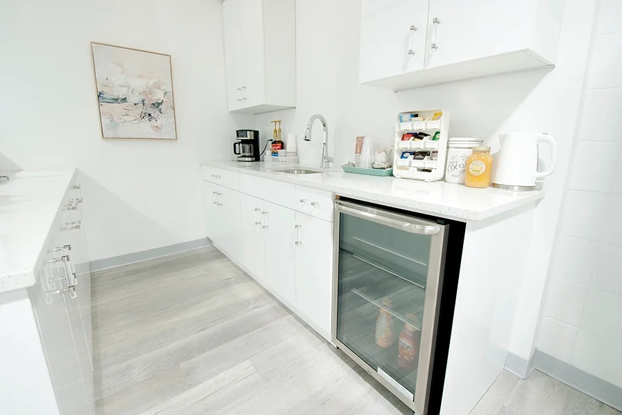 Complimentary kitchen attached to waiting room / lobby, for clients of Skinfinite Glow.