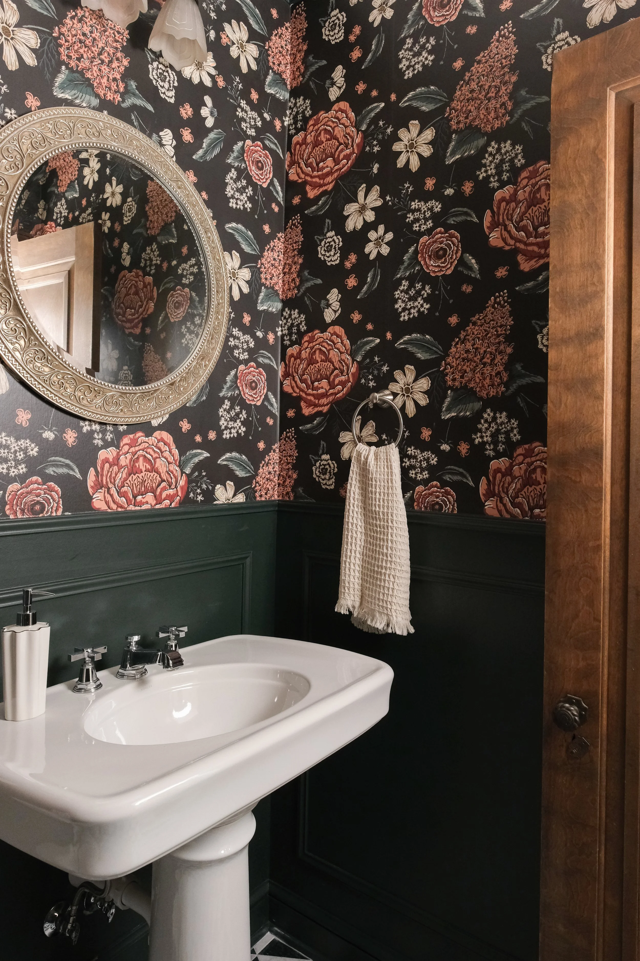 Moody illustrated wallpaper - black background, red, and cream flowers with green leaves.