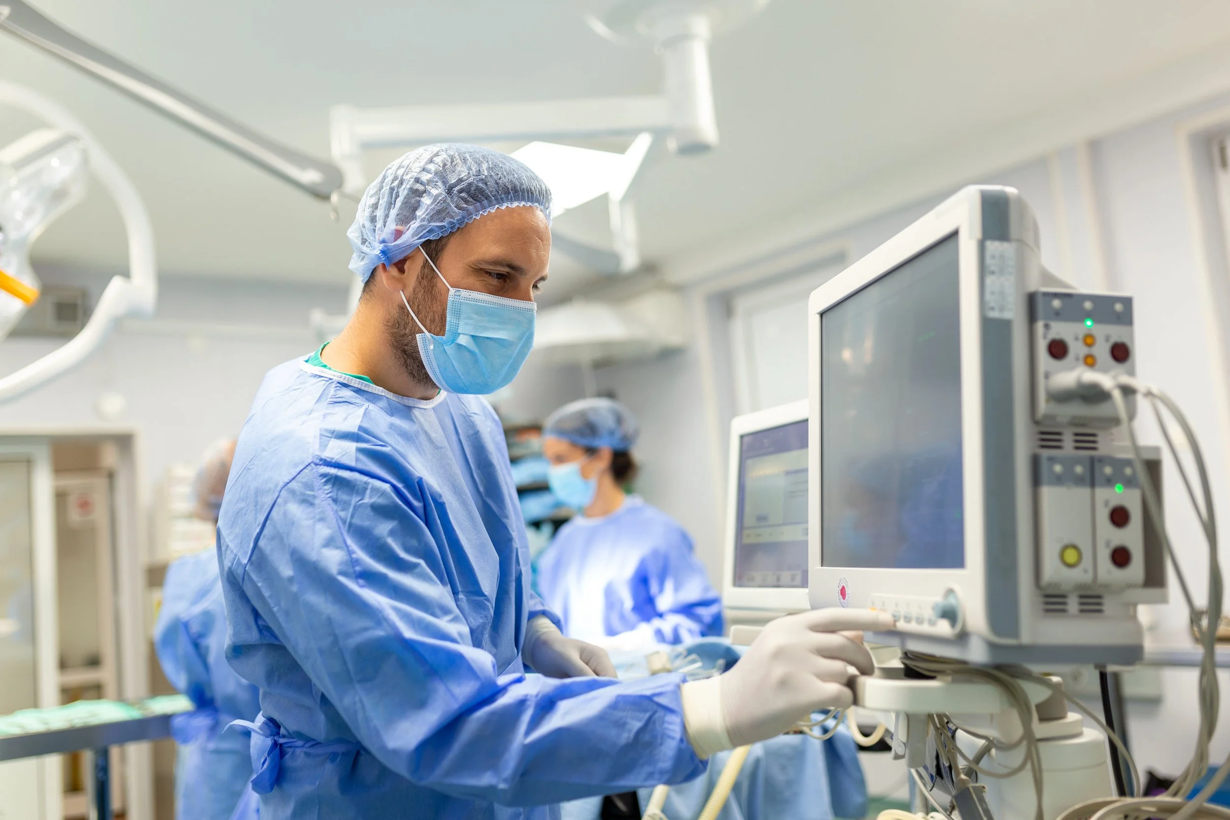 medical-ventilator-being-monitored-by-anaesthetist-surgeon-using-monitor-operating-room.jpg